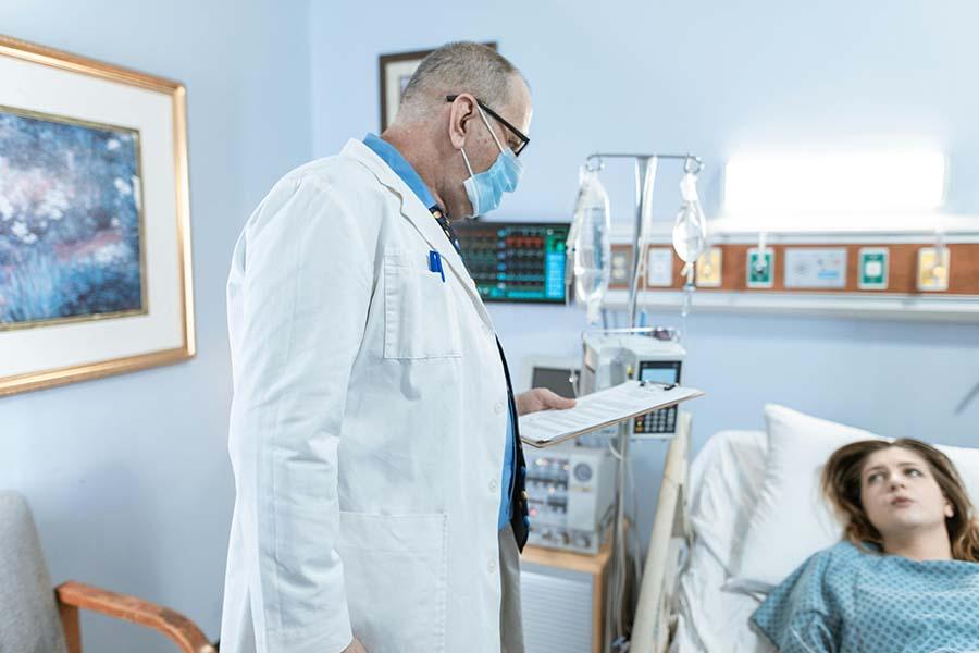 A picture of a doctor attending to a patient
