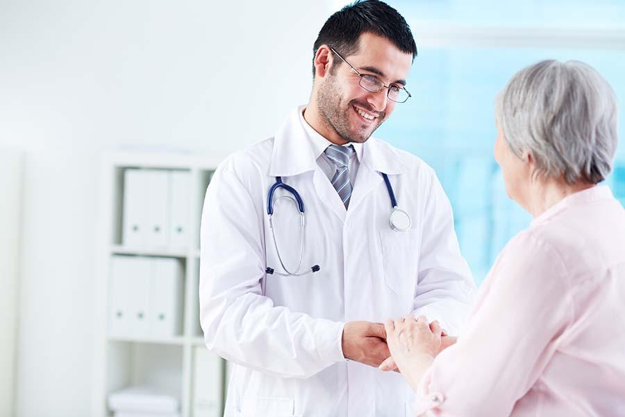 A picture of a doctor attending to a patient